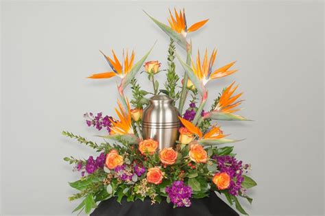 Memorial Urn Surrounded By A Bird Of Paradise Arrangement Funeral