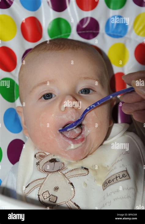 Being Fed Solid Food Hi Res Stock Photography And Images Alamy