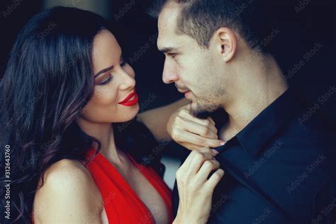 Foto Stock Tempting Milf Woman In Red Undress Sexy Young Man Adobe Stock