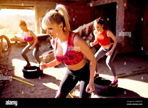 Group Of Fitness Attractive Young People Working Out Legs Squats