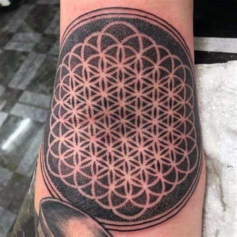 The tattoo is of a flower whose inner petals are colored maroon on the inside and white on the outside. 100 Flower Of Life Tattoo Designs For Men - Geometrical ...