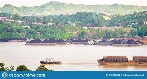 View Of Traffic Of Tugboats Pulling Barge Of Coal At Mahakam River