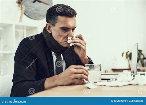 Sick Man In Suit With Scarf Sitting In Office Stock Photo Image Of