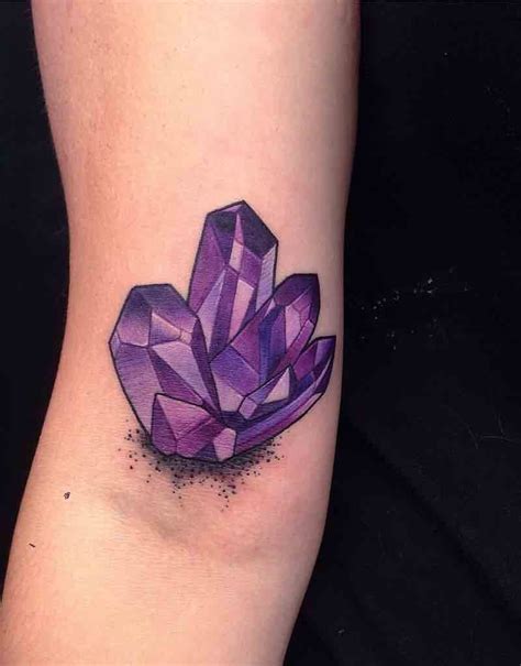 A Womans Arm With A Purple Diamond Tattoo On It