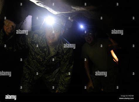 Master Sgt Rusty Chase Climbs Through A Cave During A Tour Of Iwo To