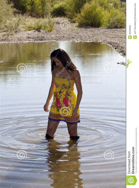 Mud and messy covered girls. Young Asian American Woman Dress Boots Water Stock Photo ...