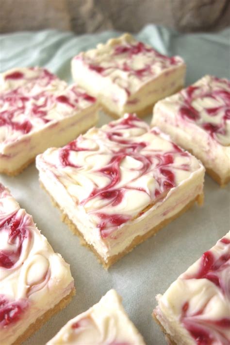The combination of raspberries and white chocolate is a real dream when it comes to puddings, and it's no different in the form of this cheesecake. White Chocolate Raspberry Cheesecake Bars - A Dash of Ginger