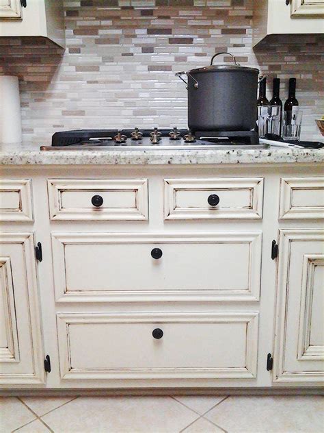It is the glaze that actually gives a slightly darker, richer look to some areas of the cabinet and creates a custom and personalized look. Antique White Kitchen Makeover | General Finishes Design ...