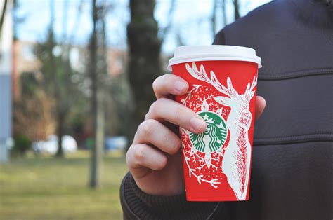Person Holding Red And White Starbucks Disposable Cup Free Image Peakpx