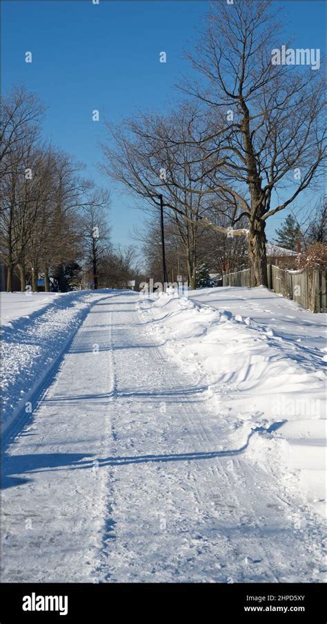 Footpath With Deep Snow For A Winter Weather Concept Vertical Format