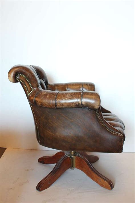 This unique type of leather has not been sanded; Vintage Tufted Distressed Leather Library Desk Swivel ...