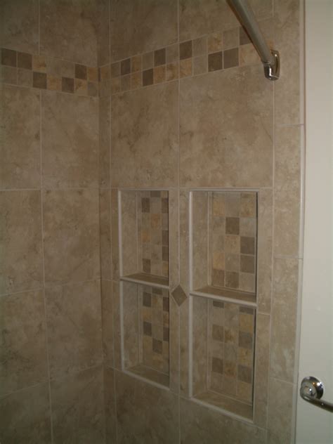 Panels coordinate beautifully with swan vanities and bathtub. Drywall to Backerboard transition in tiled showers