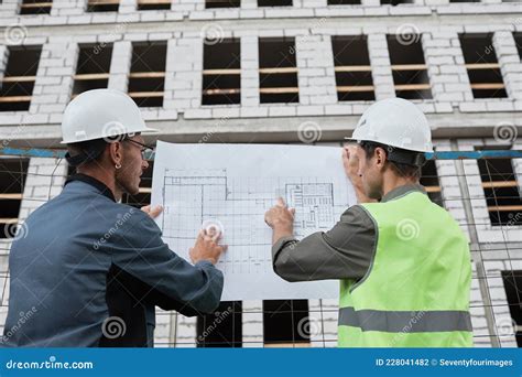 Construction Workers Discussing Plans Stock Photo Image Of Architect