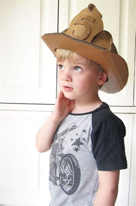 Have kids paint a small firefighter badge or symbol on one edge of their paper plate, if desired. CARDBOARD FIREMAN HELMENT | Cardboard costume, Diy cardboard, Diy fireman costumes