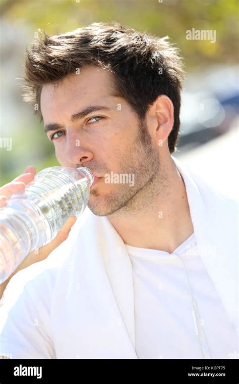 Athletic Man Drinking Water After Exercising Stock Photo Alamy