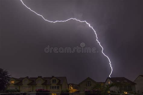 Image Of Lightning In The Night Hitting A House On The Ground Stock
