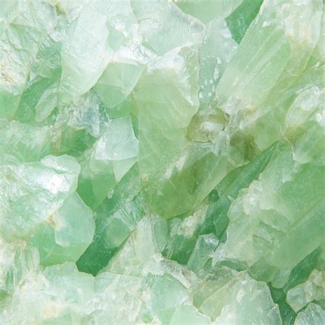 Green And White Crystals Are Stacked Together