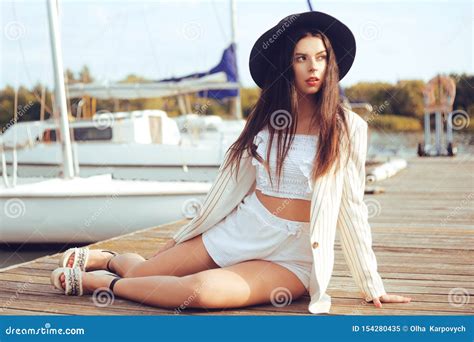 Girls On The Background Of Yachts Sailing Boats Smiling Looking At The Camera Beautiful