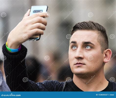 a man taking a selfie at the gay pride parade also known as christopher street day csd in munich