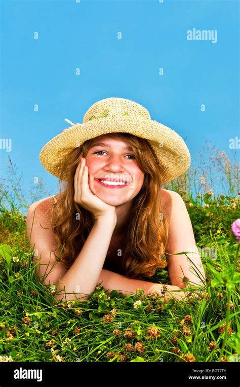 Portrait Of Girl Lying On Flower Meadow Hi Res Stock Photography And