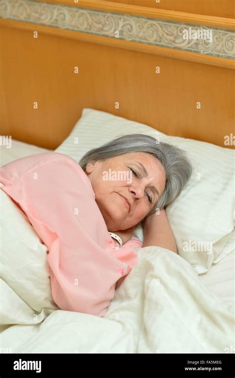 Attractive Mature Woman Sleeping Bed Hi Res Stock Photography And