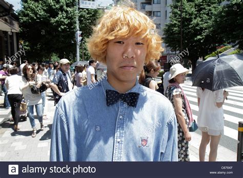 But losing your hair may be especially difficult in countries where it's less common. Tokyo Japan Harajuku JR Harajuku Station Asian man blonde ...