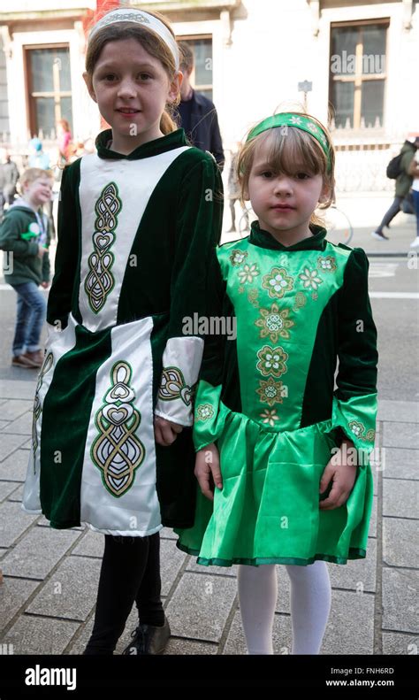 Two Young Girls Dressed In Traditional Irish Costume Attend The St Patricks Day Parade In London