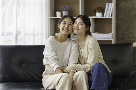 Happy Lgbtq Asian Lesbian Couple Two Asian Girls Show Their Love By Cuddling At Home Stock