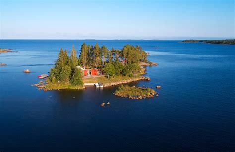 A Private Swedish Island With Striking Red Cabin Home Could Be Yours