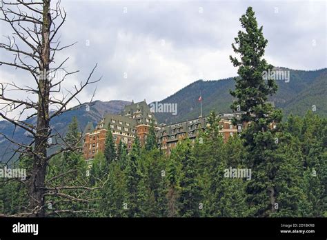 Fairmont Banff Springs Hotel In The Middle Of Mountains And Forest In