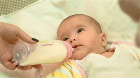 When Do Babies Hold Their Own Bottle The Average Age And More