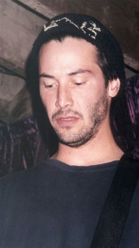 A Man With His Eyes Closed Wearing A Tiara And Looking Down At The Camera