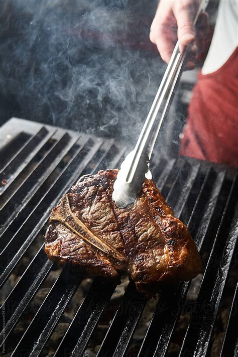 Chef Preparing Grilled Meat Steak By Stocksy Contributor Pietro Karras Stocksy