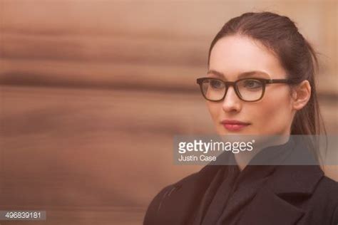 Close Portrait Of A Brunette Classy Urban Woman Wearing Glasses And Glasses Wearing