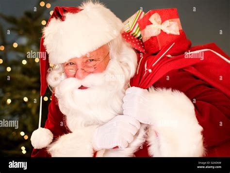 Portrait Of Santa Claus Carrying Sack Over Shoulder Stock Photo Alamy