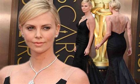 Charlize Theron Is A Statuesque Beauty In Plunging Black Gown On Oscars