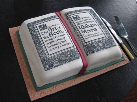 Stack of books, candles, birthday cake. William Morris Birthday Cakes