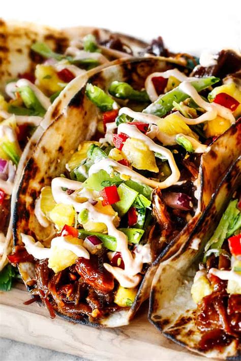 Add the pork roast and brown on all sides, about 3 minutes per side. Asian Caramel Pulled Pork Tacos with Pineapple Snow Pea Slaw