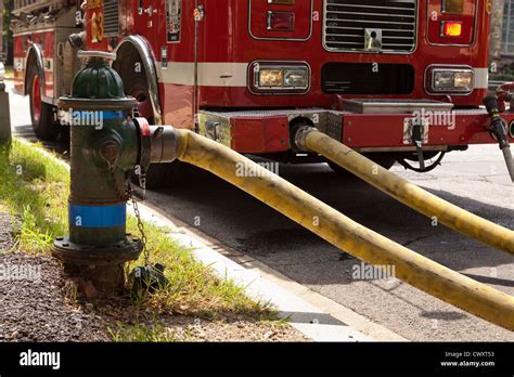 Firetruck Hose Mounted On Hydrant Stock Photo Alamy