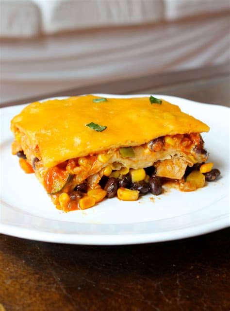 This chicken enchilada casserole is made with an avocado cream sauce for an easy creamy chicken enchilada casserole that the whole family will love! Layered Zucchini and Chicken Enchilada Casserole - Smile ...