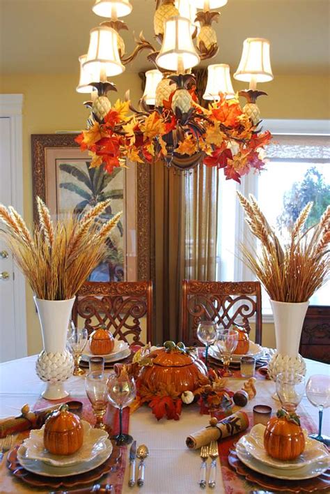 Try hurricane lamp candle holders,. Beautiful Wheat Centerpiece with Pumpkin Tureens