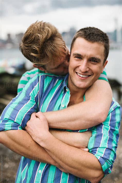Happy Gay Couple Hugging Outdoors Del Colaborador De Stocksy Simone Wave Stocksy