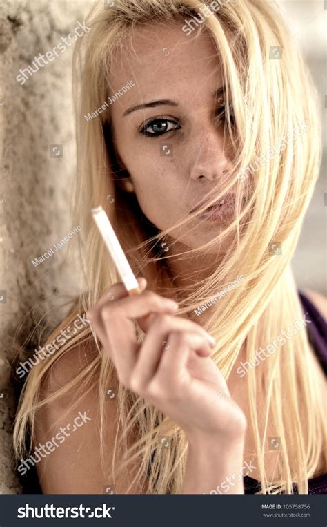 Beautiful Woman Smoking A Cigarette Stock Photo 105758756