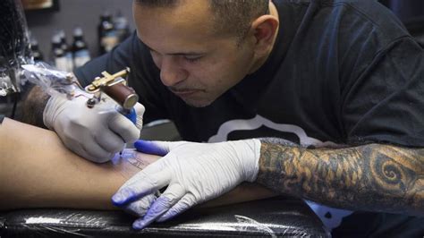kansas city tattoo artist julio morales  making  mark