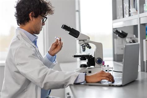 Scientist With Microscope Working In Laboratory Stock Photo Image Of