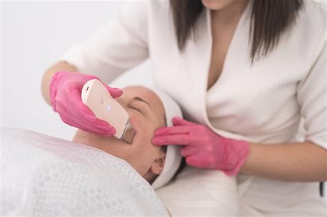 premium photo facial cleansing experience with ultrasonic scrubber therapy closeup