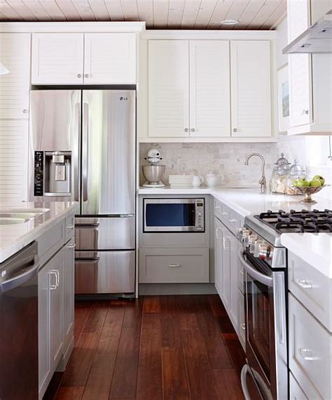 Install upper cabinets follow the steps below to ensure an efficient and accurate wall cabinet installation. White Upper Cabinets Gray Lower Cabinets - Transitional ...