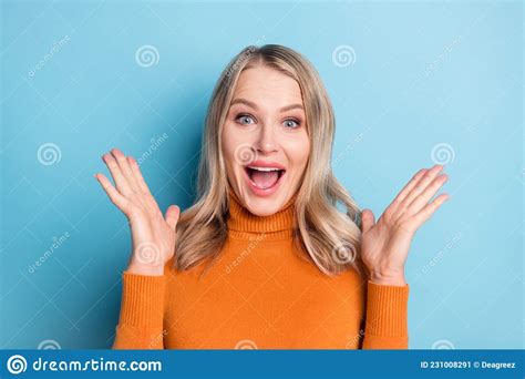 Photo Of Young Amazed Shocked Happy Woman Raise Palms News Discount Isolated On Blue Color