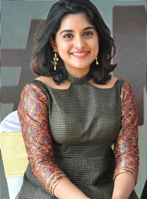 nivetha thomas beautiful smile images in green outfit in 2021 beautiful indian actress beauty