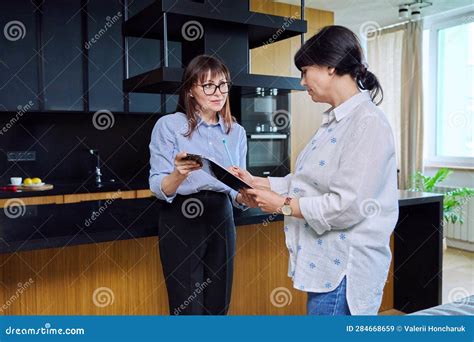 Female Real Estate Agent Showing Apartment House To Buyer Tenant Stock Image Image Of